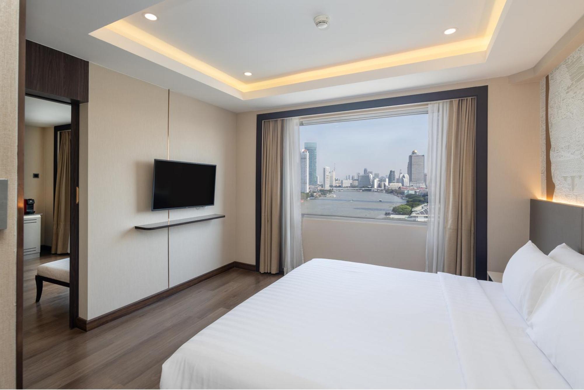 Suite mit Kingsize-Bett, Balkon und Flussblick